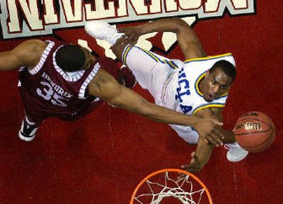 
Alabama's Richard Hendrix and UCLA's Arron Afflalo jockey for a rebound during Saturday's second-round game at San Diego. 
 (Associated Press / The Spokesman-Review)
