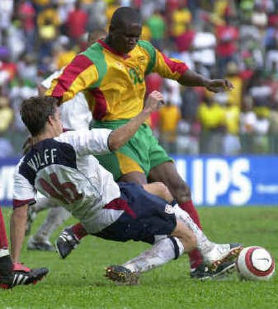 
American Josh Wolff, left, and Grenada's Franklyn Baptiste battle for the ball Sunday. 
 (Associated Press / The Spokesman-Review)