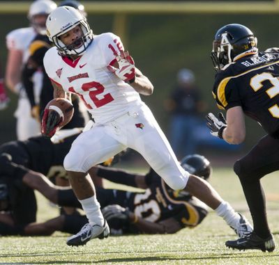 Illinois State’s Tyrone Walker evades a defender on his way to 41-yard touchdown. (Associated Press)