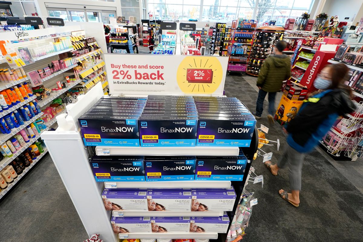 Boxes of BinaxNow home COVID-19 tests made by Abbott and QuickVue home tests made by Quidel are shown for sale Monday, Nov. 15, 2021, at a CVS store in Lakewood, Wash., south of Seattle. After weeks of shortages, retailers like CVS say they now have ample supplies of rapid COVID-19 test kits, but experts are bracing to see whether it will be enough as Americans gather for Thanksgiving and new outbreaks spark across the Northern and Western states.  (Ted S. Warren)