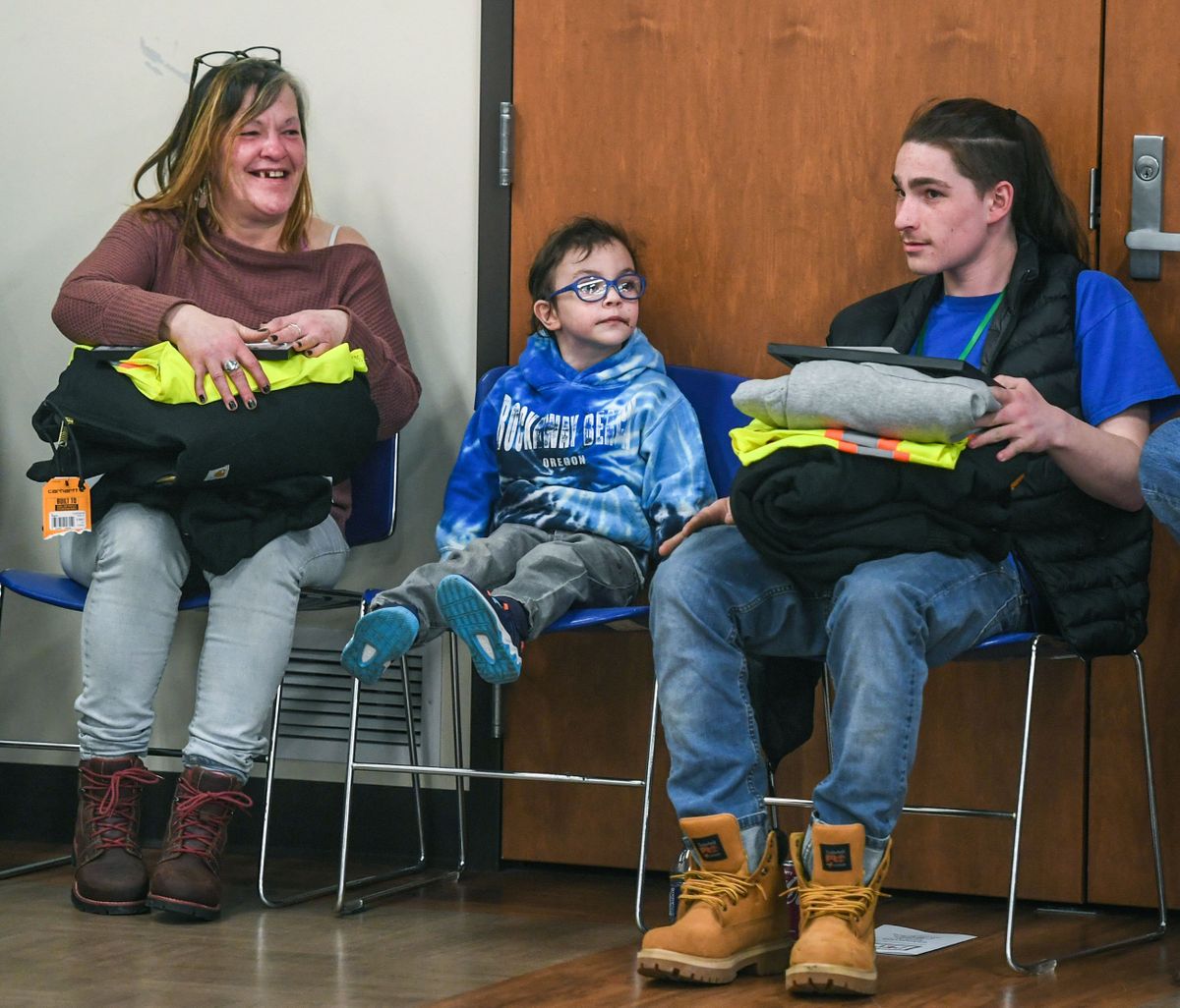 Among students completing the Pre-Employment Preparation Program on Friday at the Northeast Community Center in Spokane are Misty Carson, left, and her son Ryan Carson, right, while visiting with Misty’s grandson, Ezra Austin, 4.  (DAN PELLE/THE SPOKESMAN-REVIEW)