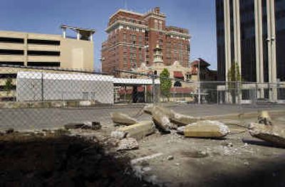 
The lot at First Avenue and Post Street in downtown Spokane sits empty, but Walt Worthy says his project is expected to be finished by late 2006.
 (Dan Pelle / The Spokesman-Review)