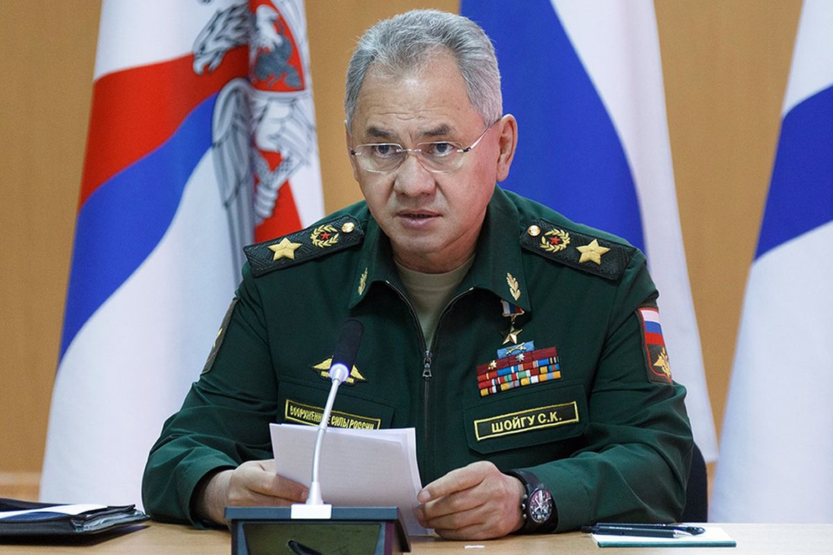 In this handout photo released by Russian Defense Ministry Press Service, Russian Defense Minister Sergei Shoigu speaks as he visits a naval base in in Gadzhiyevo, Russia, Tuesday, April 13, 2021. Shoigu on Tuesday described a massive military buildup in western Russia as part of drills intended to check the armed forces