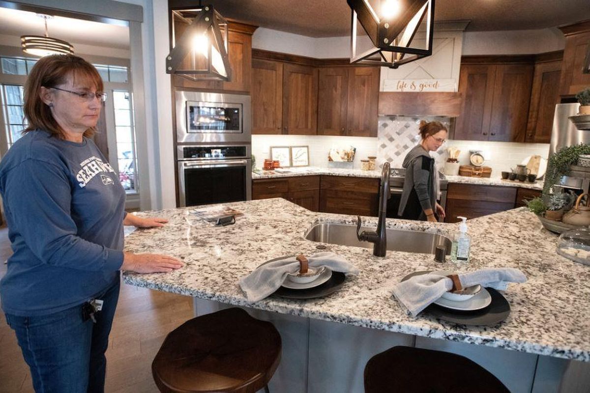 During the 14th annual Fall Festival of Homes tour, Mary Wier, on left, and her daughter Erika O’Callaghan check out a high-end kitchen in the Paras Homes Huntington model in Eagle Ridge on Sunday, Sept. 30, 2018. The festival is a showcase of new home construction, and features 30 houses this year.The show will continue next weekend. (Colin Mulvaney / SR)