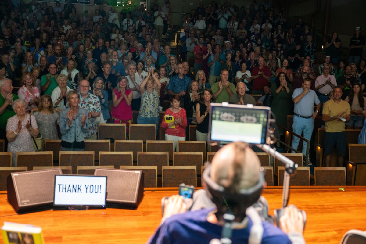 Steve Gleason receives a standing ovation at the Northwest Passages event, were Gleason and Times-Picayune columnist Jeff Duncan talked about writing Gleason's memoir, "A Life Impossible: Living With ALS: Finding Peace and Wisdom Within a Fragile Existence." Also on stage leading the conversation is Spokesman-Review sports writer Dave Boling and Gleason’s wife Michel, Sunday, August 4, 2024, at the Myrtle Woldson Performing Arts Center.  (COLIN MULVANY/THE SPOKESMAN-REVIEW)
