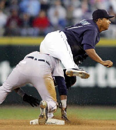 
Detroit's Marcus Thomas, left, is forced out at second as Seattle's Jose Lopez turns double play.
 (Associated Press / The Spokesman-Review)