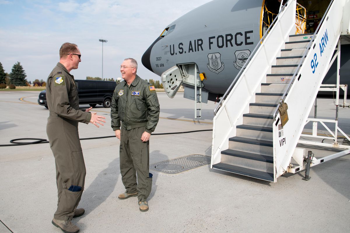 Old friends Colonel Chris Holland, left, of the 916th Air Refueling Wing, and Colonel Russ Davis, right, of the 92nd Air Refueling Wing, catch up on the flightline next to a KC135 air refueling tanker that Holland helped deliver Wednesday, Oct. 16, 2019 at Fairchild Air Force Base. The plane, being transferred from the 916th Air Refueling Wing to the 92nd Air Refueling Wing at Fairchild, is the first of 12 planes coming to the base near Spokane to become part of a newly reactivated squadron. When all the planes are at Fairchild, the base will be the biggest single tanker base in the U.S. Air Force. The 916th ARW will be getting the new KC46 air tanker when they are ready for deployment. Holland is the Operations Group Commander of the 916th ARW and Davis holds the same title with the 92nd ARW. Holland and Davis have known each other for about 10 years after serving together overseas. (Jesse Tinsley / The Spokesman-Review)