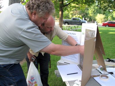 Mayor Allan Gainer helps a resident find his house on an aerial view of Cheney at Veterans’ Memorial Park. The two were attending city’s Tree City USA open house last week. (Lisa Leinberger / The Spokesman-Review)