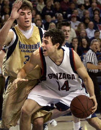 
Brian Michaelson draws the foul from Northern Colorado's Sean Taibi.
 (Jed Conklin / The Spokesman-Review)