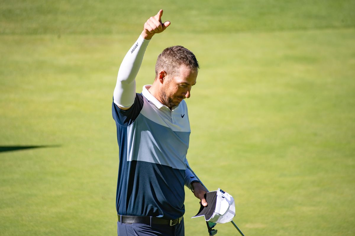Scott Erdmann celebrates winning the 32nd annual Rosauers Open Invitational title at Indian Canyon Golf Course. (Libby Kamrowski / The Spokesman-Review)