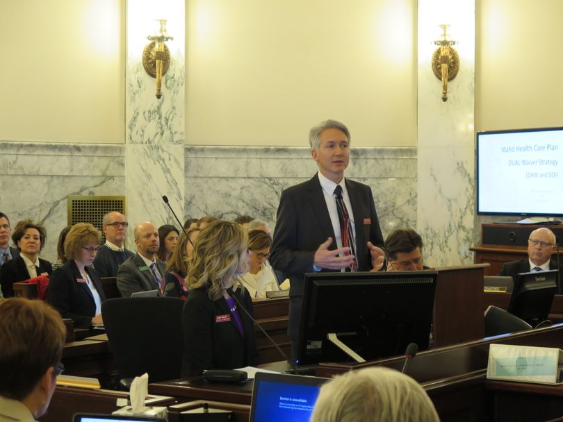 Russ Barron, director of the Idaho Department of Health & Welfare, addresses JFAC on Monday morning, Jan. 15, 2018, along with Deputy Director Lori Wolff, left, and state Insurance Director Dean Cameron, right. (Betsy Z. Russell)