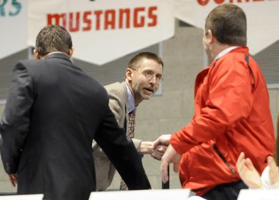 North Central cross country coach Jon Knight accepts congratulations after being named male junior coach of the year.  (Jesse Tinsley / The Spokesman-Review)