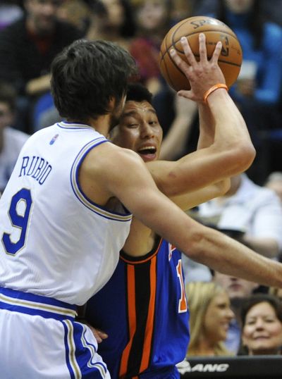 Timberwolves' Ricky Rubio, left, puts pressure on Knicks' Jeremy Lin in the first half of Saturday game won by Knicks. (Associated Press)