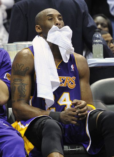 Kobe Bryant and the Lakers suffered another road loss. (Associated Press)