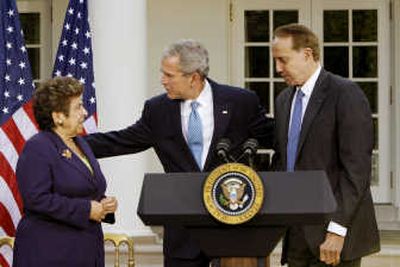 
President Bush stands with former Health and Human Services Secretary Donna Shalala and former Senate Majority Leader Bob Dole in the Rose Garden of the White House on Tuesday. Associated Press
 (Associated Press / The Spokesman-Review)