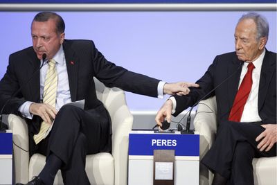 Recep Tayyip Erdogan, prime minister of Turkey, left, talks to Israeli President Shimon Peres  in Davos, Switzerland, on Thursday.  (Associated Press / The Spokesman-Review)