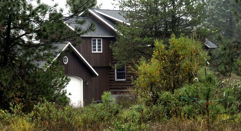 Idaho state Rep. Phil Hart's log home in Athol, Idaho, built partly with logs taken from state school endowment land (Kathy Plonka / The Spokesman-Review)