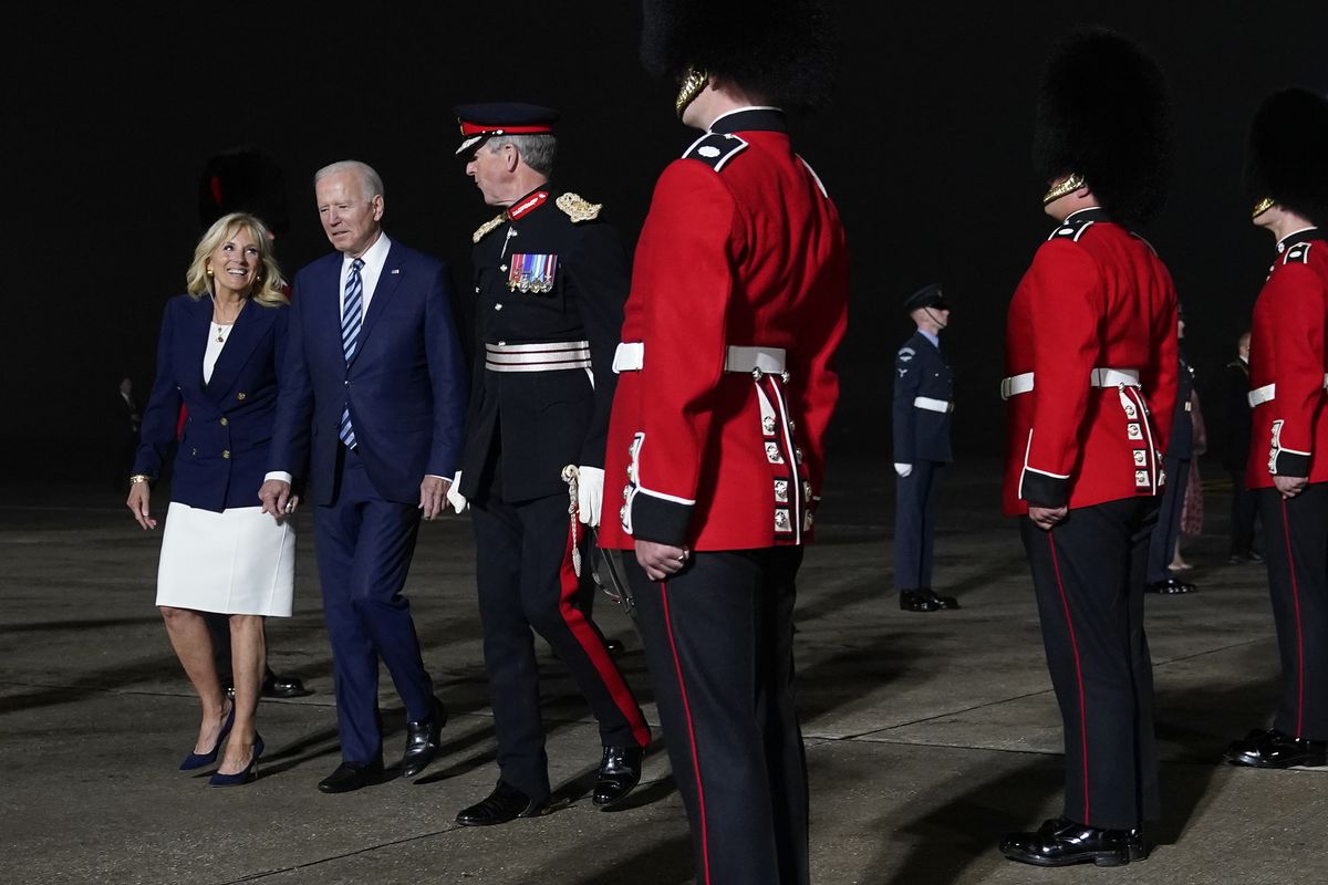 President Joe Biden and Jill Biden are escorted by Colonel Edward Bolitho, Lord Lieutenant of Cornwall, after stepping off Air Force One at Cornwall Airport Newquay, Wednesday, June 9, 2021, in Newquay, England. The Bidens are en route to the G-7 summit in Carbis Bay, England.  (Patrick Semansky)