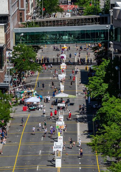Hoopfest players finish their games for the day along Riverside Avenue on Saturday, June 25, 2022. Law enforcement reported few criminal incidents in Hoopfest's return to downtown streets for 2022.   (COLIN MULVANY/THE SPOKESMAN)