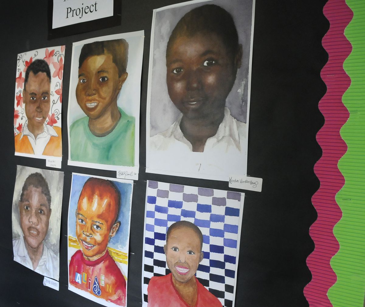 Northwest Christian School’s Advanced Art class painted portraits of children in Uganda and sent the artwork to them. (Dan Pelle)