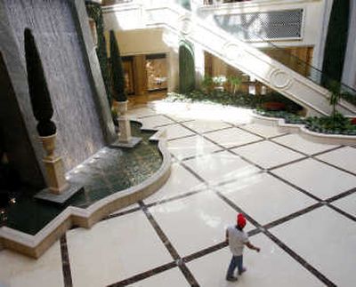 
File Associated Press Earlier this month,  a hotel guest checks out a waterfall inside the Palazzo hotel and casino in Las Vegas.
 (File Associated Press / The Spokesman-Review)