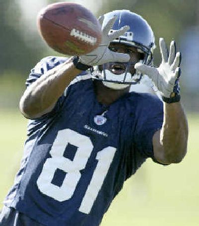 
Seattle receiver Nate Burleson said today's Minnesota matchup is just another game. 
 (Associated Press / The Spokesman-Review)