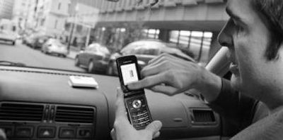 
Andrew Rollert demonstrates how the service lets drivers find available parking spaces using a cell phone  recently in Boston.
 (Photos Associated Press / The Spokesman-Review)