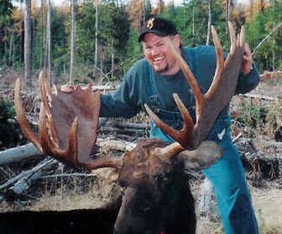 Jeff McKeen poses with the Washington state record moose he bagged north of Colville in November 2004. The moose scored 168 4/8 Boone and Crockett points.
(Photo courtesy of Jeff McKeen / The Spokesman-Review)
