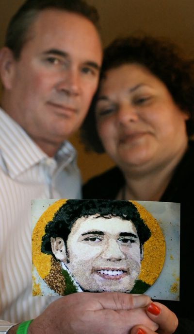 John and Daria Miller pose with the floragraph of their son.  (Associated Press / The Spokesman-Review)
