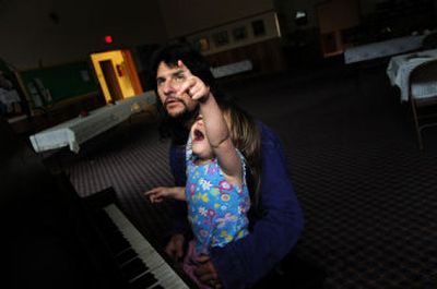 
Terrence Craven and his daughter, Bionkah, play the piano at Fowler Methodist Church in Spokane on June 6. Craven lost custody of Bionkah after bouts with alcohol and drugs but worked to get her back and now runs a support group called Dads Helping Dads. 
 (Rajah Bose / The Spokesman-Review)