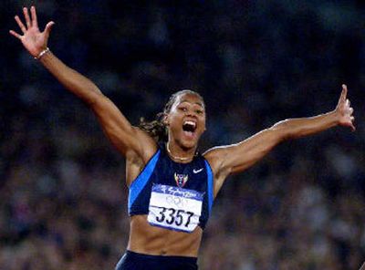 
Marion Jones was on top of the world after winning 100-meter dash at Sydney Olympics.
 (Associated Press / The Spokesman-Review)