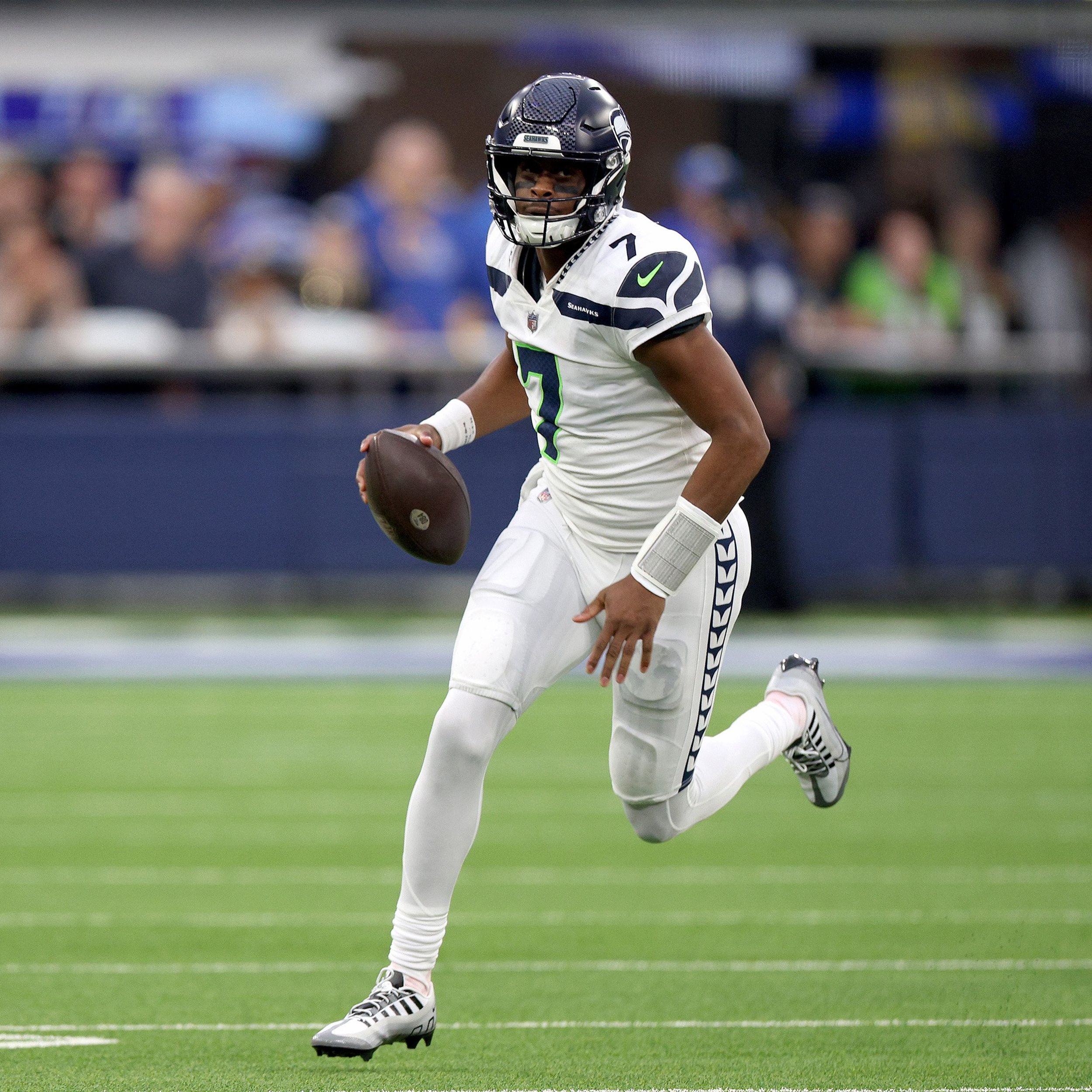 Seattle Seahawks quarterback Geno Smith (7) scrambles as he plats