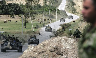 Russian armored vehicles move in Orjosani, between the capital Tbilisi and the strategic town of Gori, Georgia, Saturday.  (Associated Press / The Spokesman-Review)