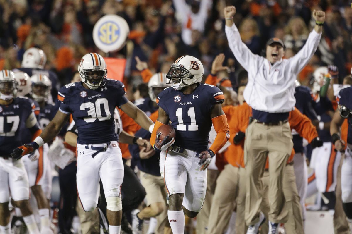 Auburn’s Chris Davis returns a missed field-goal attempt more than 100 yards for a touchdown to defeat Alabama as time expired. (Associated Press)