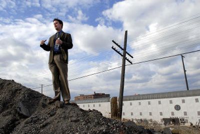 
Cody George, Spokane's economic development adviser, stands on a site near Sprague Avenue and Grant Street  in Spokane, where the city envisions a pedestrian bridge over railroad tracks that would link the East Sprague Avenue area to the growing University District. 
 (Photos by DAN PELLE / The Spokesman-Review)