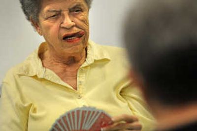 
Gloria Murphy checks her cards during a game of bridge at Corbin senior center in Spokane last Thursday. 
 (Rajah Bose / The Spokesman-Review)