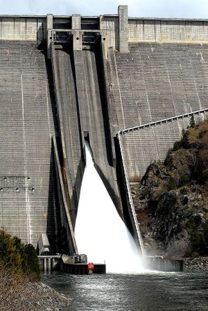 In this 2008 photo, the spillways of Dworshak Dam churn out excess water in Clearwater County, Idaho. (Barry Kough / Associated Press)