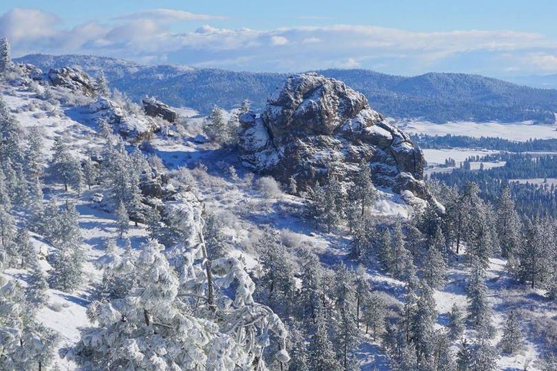 Big Rock and the Rocks of Sharon glisten under a dusting of cold, fresh snow in Spokane Valley. (Mary Weathers / Dishman Hills Conservancy)