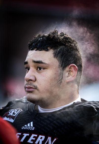Condensation rises from Eastern Washington defensive lineman Rudolph Mataia Jr. on the sideline Dec. 10 during the second half of an FCS quarterfinal college football game at Roos Field in Cheney. (Colin Mulvany / The Spokesman-Review)