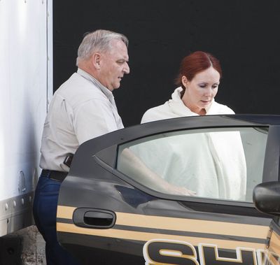 Shannon Richardson is placed into a Titus County Sheriff's car after an initial court appearance Friday. (Associated Press)