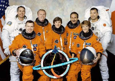 
Astronauts front row: left, pilot James Kelly, Mission Specialist Wendy Lawrence, center, and Commander Eileen Collins. Second row from left, Mission Specialists Stephen Robinson, Andy Thomas, Charles Camarda, and Soichi Noguchi.
 (Associated Press / The Spokesman-Review)