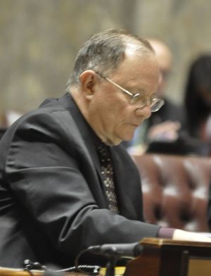 OLYMPIA -- Sen. Mike Padden listens to debate over a bill that would change pay for presidential electors. (Jim Camden)