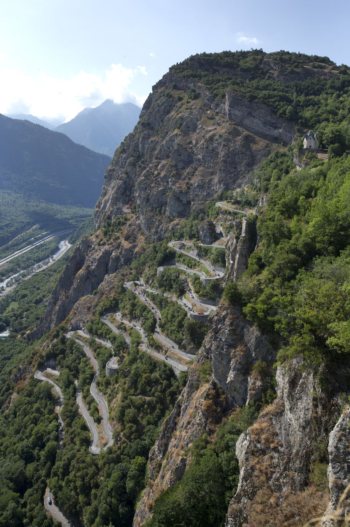 Riders climb the 18 harpins of the Montvernier Laces for first time in Tour’s 112-year history. (Associated Press)