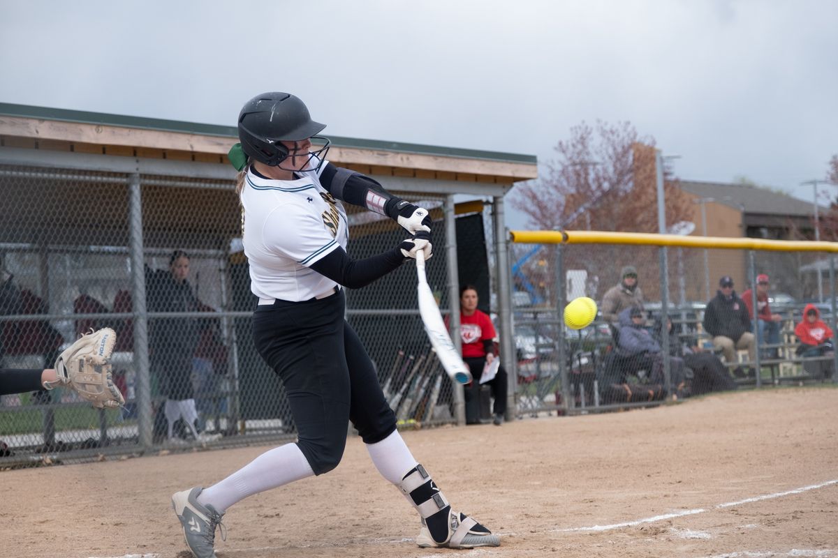 Shadle Park pitcher Crimson Rice hits a three-run home run during the first inning of a Greater Spokane League 2A softball game against Clarkston on Tuesday, April 16, 2024, at Shadle Park High School in Spokane, Wash,  (Madison McCord/For The Spokesman-Review)