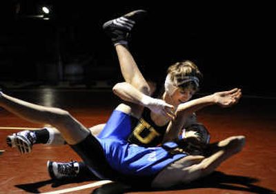
U-Hi wrestler Anthony Rivera takes Skyview's Preston Hu to the mat during the 125-pound match. Rivera won with a technical fall. 
 (Dan Pelle / The Spokesman-Review)
