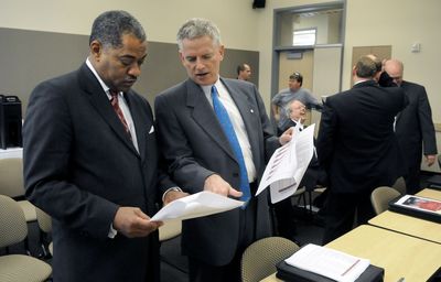 Washington State University President Elson Floyd, left, and Provost and Executive Vice President Warwick Bayly prepare for their presentation to the WSU board of regents  at the WSU Academic Center in Spokane on Friday.  (Dan Pelle / The Spokesman-Review)