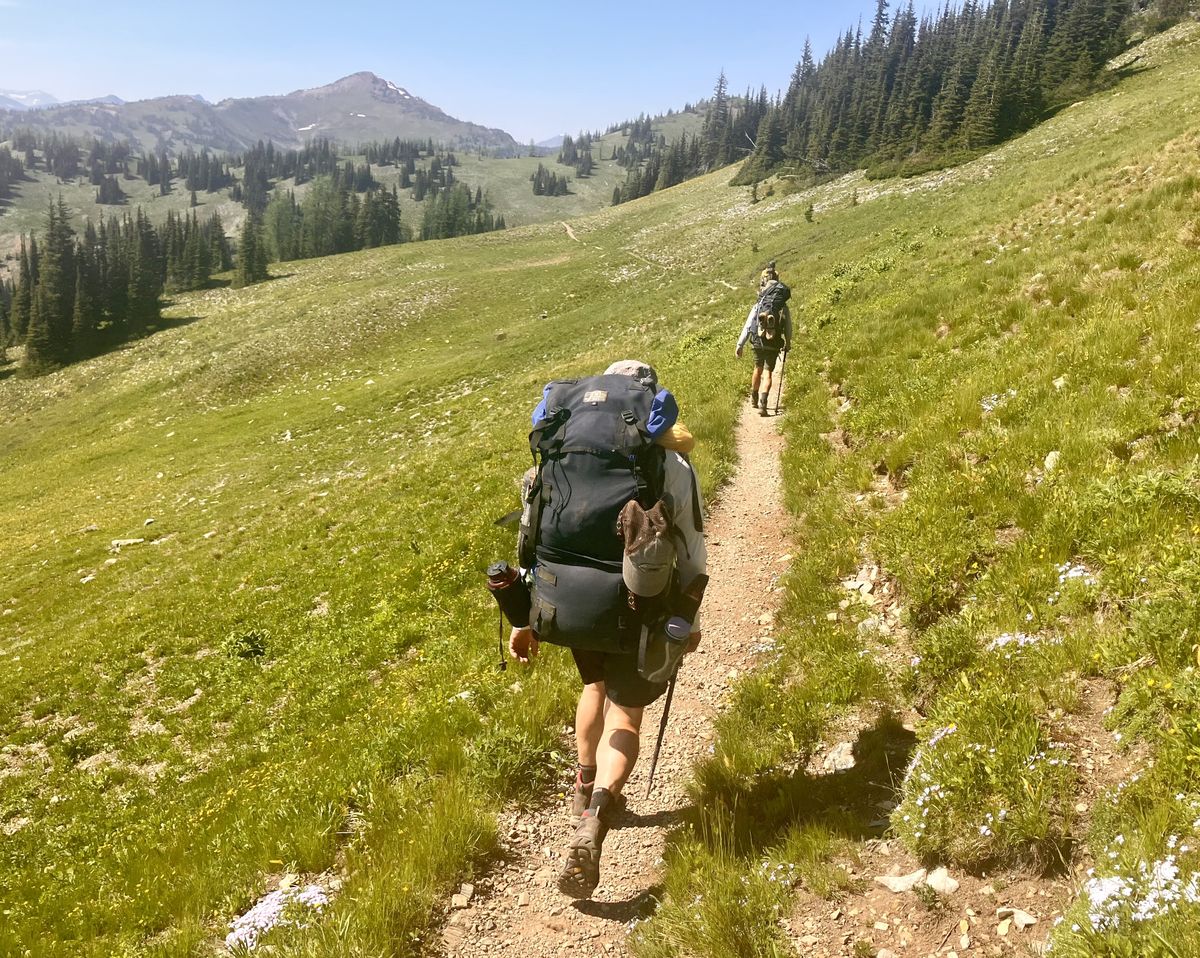 Packs are heavy on day one of a hike into the North Cascades. (John Nelson)