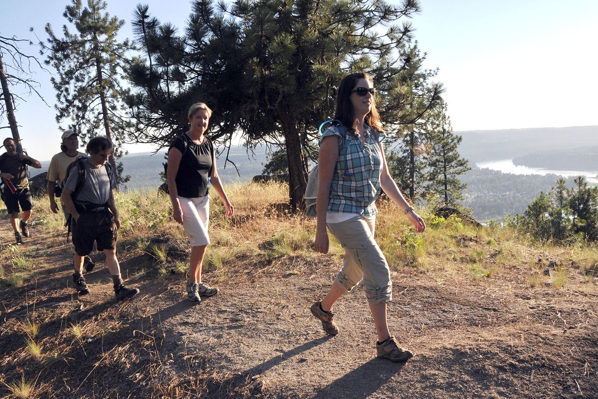 Hikers follow the Knothead Trail overlooking the confluence of the Spokane and Little Spokane rivers. (Rich Landers)
