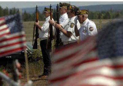 
Jack Davis, commander of the Spokane Veterans Honor Guard, salutes as, from left, Ron Henry, Vern Johnson and Thomas Christie stand at attention to pay tribute to the 56 veterans of the Grand Army of the Republic   at Evergreen Cemetery in Hillyard.
 (J. BART RAYNIAK / The Spokesman-Review)