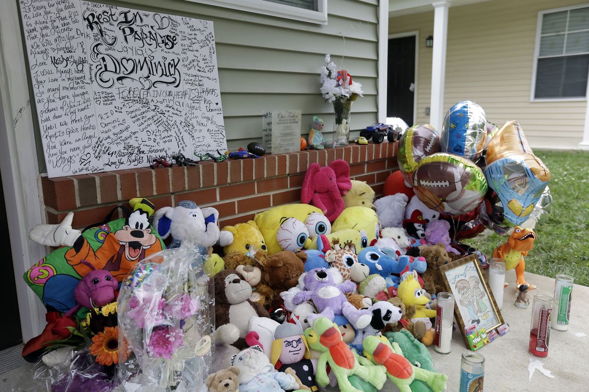 A makeshift memorial for the slain Dominick Andujar sets on his front porch, Tuesday, Sept. 4, 2012, in Camden, N.J. Authorities say 31-year-old Osvaldo Rivera killed 6-year-old Andujar and critically injured his 12-year-old sister in Camden early Sunday. (Matt Rourke / Associated Press)